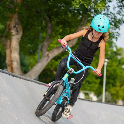 Kid riding bike at skatepark